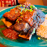 Beef short ribs in guajillo sauce in la rumba asheville